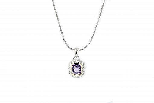 Italian sterling silver pendant with amethyst center stone and solid 14K yellow gold accents.  The chain is included