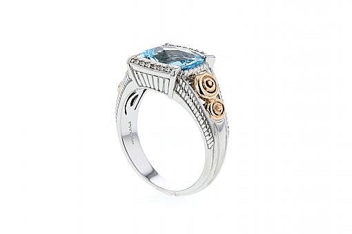Italian sterling silver ring with a blue topaz center and 0.05ct diamond with 14K solid yellow gold accent