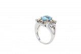 Limited Edition Italian sterling silver ring with a blue topaz center stone, 0.13ct white diamonds and 14K solid yellow gold accents