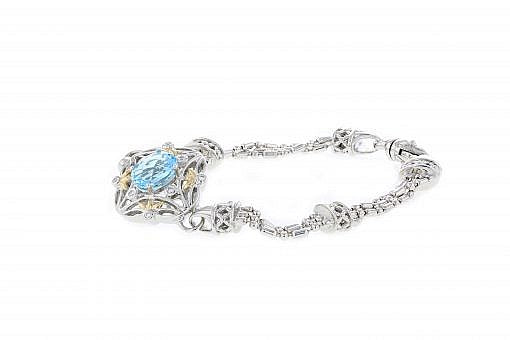 Italian sterling silver bracelet with blue topaz center stone, 0.15ct white diamonds and solid 14K yellow gold accents