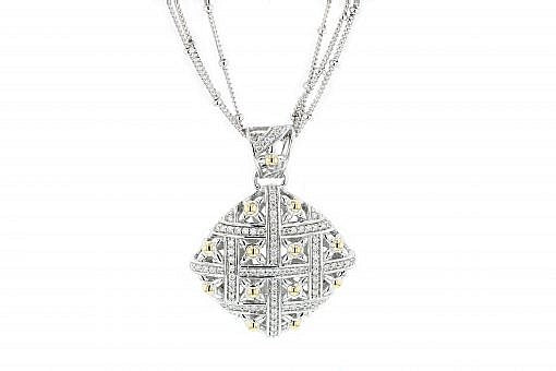 Italian sterling silver pendant with 0.87ct H color VS diamonds and solid 14K yellow gold accents. A multi-strand silver chain is included.