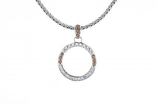 Italian sterling silver pendant with 0.30ct diamonds and solid 14K rose gold accents. The chain is included.